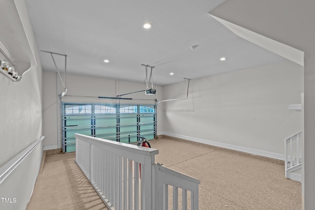 hall featuring light speckled floor, recessed lighting, and baseboards