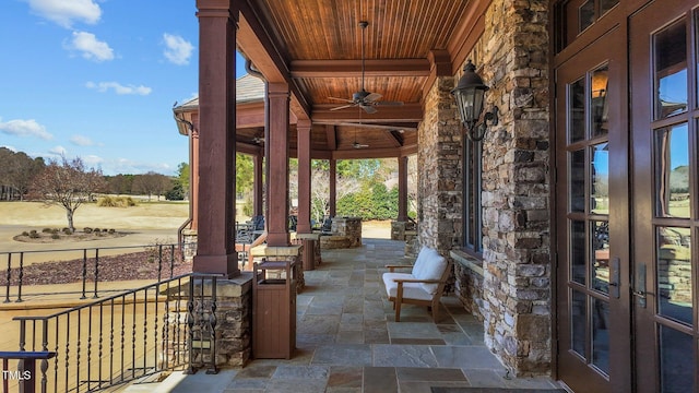 view of patio / terrace featuring a ceiling fan and covered porch