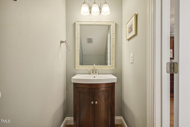 bathroom with vanity and baseboards