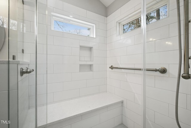 full bath featuring a stall shower and vaulted ceiling