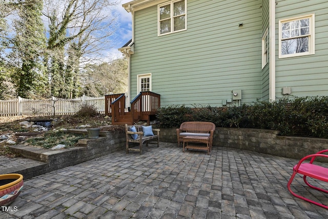 view of patio featuring fence