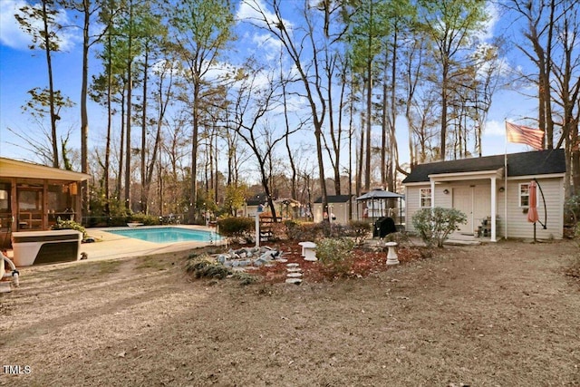 view of yard featuring a gazebo, a patio area, and an outdoor pool