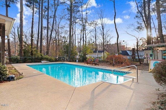 view of pool featuring fence, a fenced in pool, and a patio