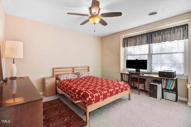 bedroom featuring baseboards, visible vents, ceiling fan, and carpet flooring