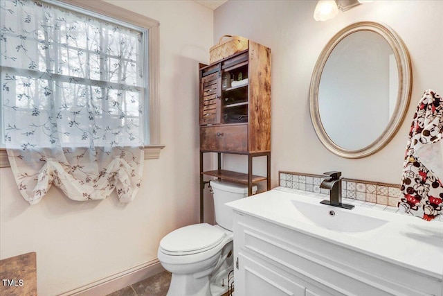 bathroom featuring toilet and vanity