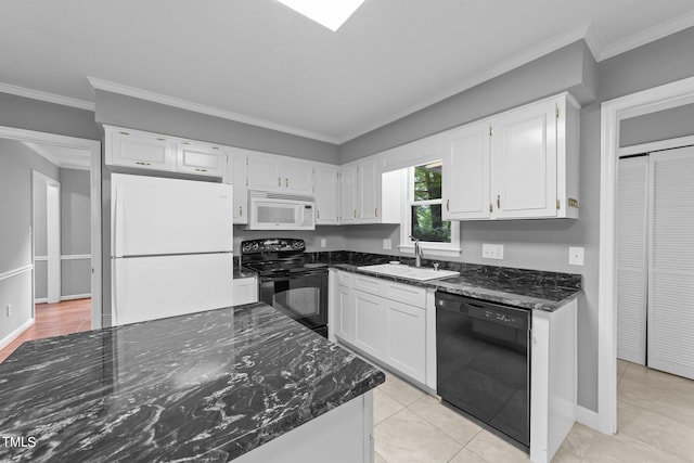 kitchen featuring white cabinets, a sink, and black appliances