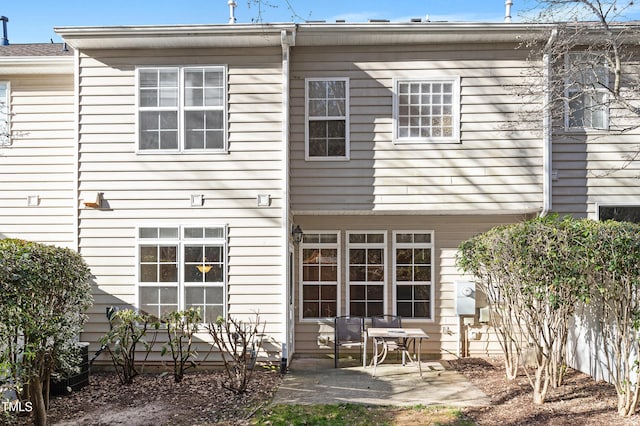 rear view of property featuring a patio