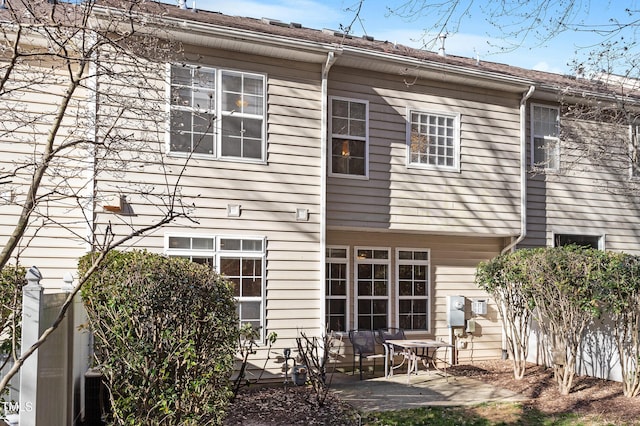 back of property featuring a patio area