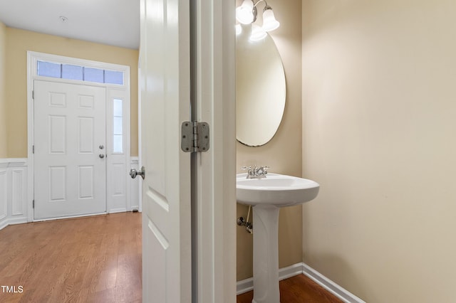 bathroom featuring a sink and wood finished floors