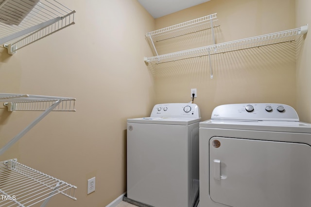 laundry room featuring washer and dryer and laundry area