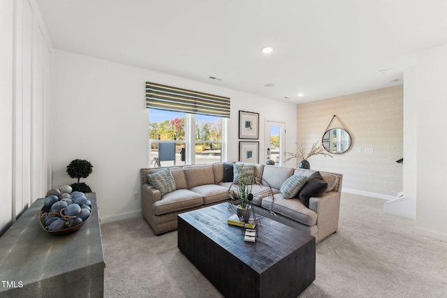 living area with wallpapered walls, recessed lighting, baseboards, and light colored carpet