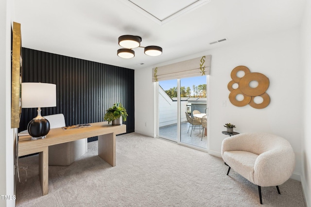 office area featuring visible vents and carpet flooring