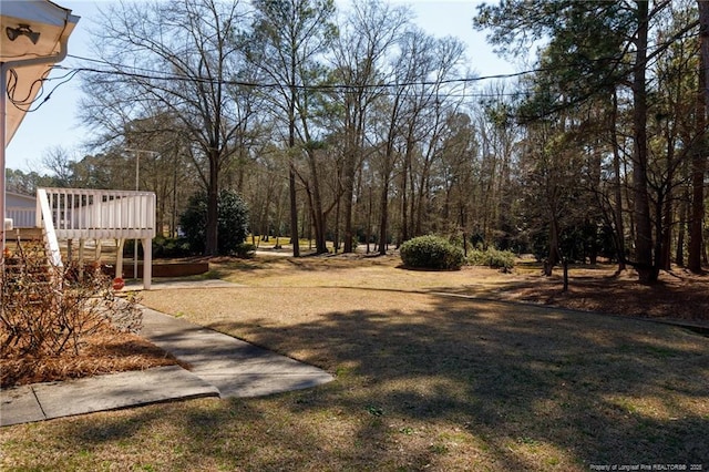 view of yard featuring a wooden deck