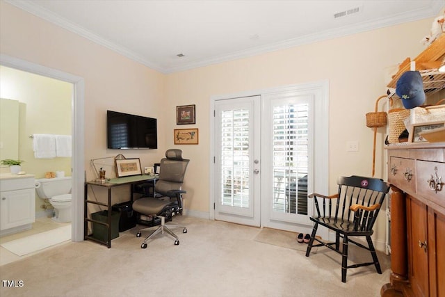 carpeted office space with baseboards, visible vents, french doors, and ornamental molding