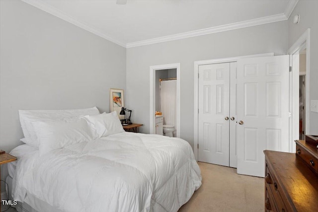 bedroom with light carpet, ensuite bath, ornamental molding, and a closet