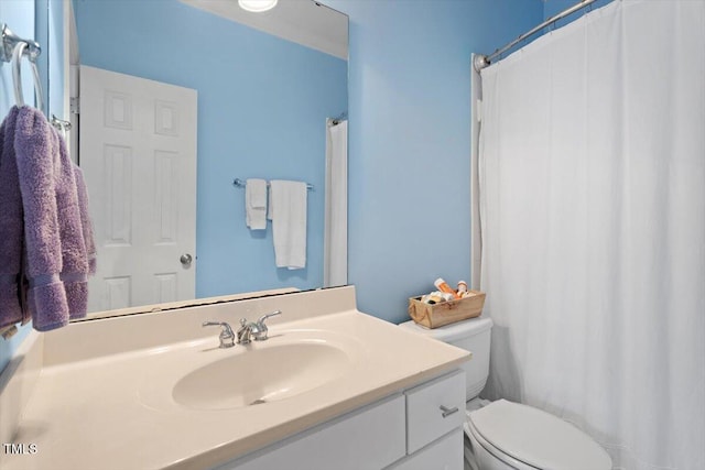 bathroom featuring vanity and toilet