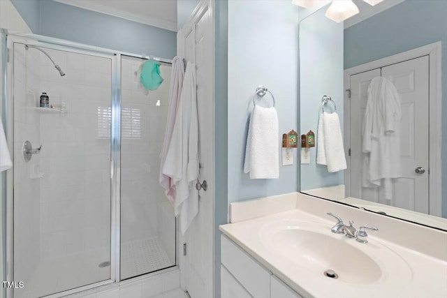 bathroom featuring a shower stall and vanity