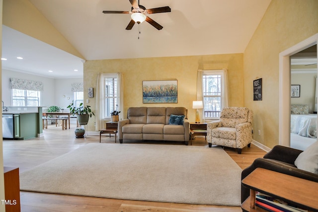 living room featuring lofted ceiling, recessed lighting, wood finished floors, a ceiling fan, and baseboards