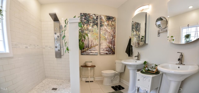 full bathroom featuring baseboards, toilet, and walk in shower