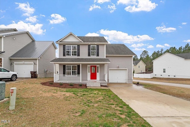 traditional home featuring a porch, a garage, a front yard, and driveway