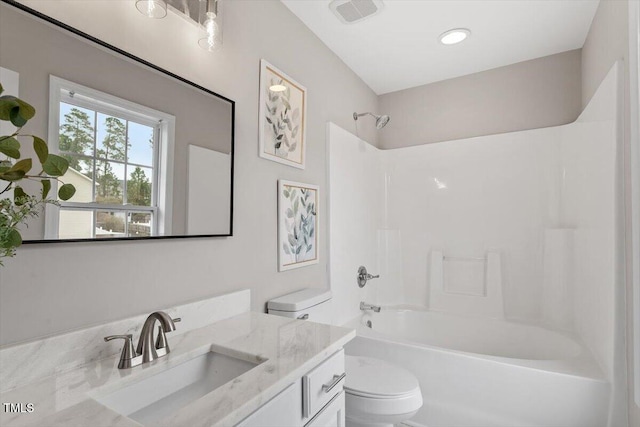 bathroom with vanity, bathing tub / shower combination, toilet, and visible vents