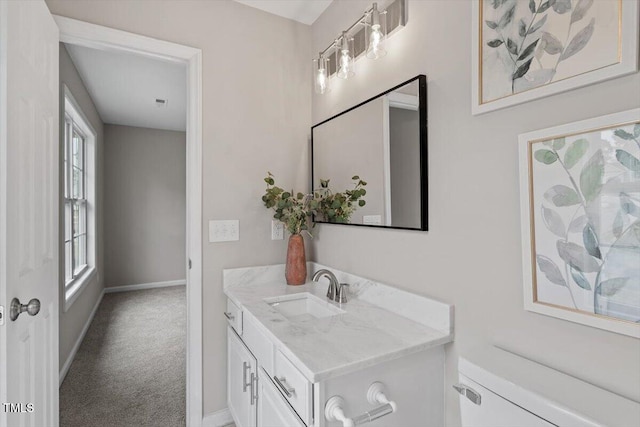 bathroom with vanity and baseboards