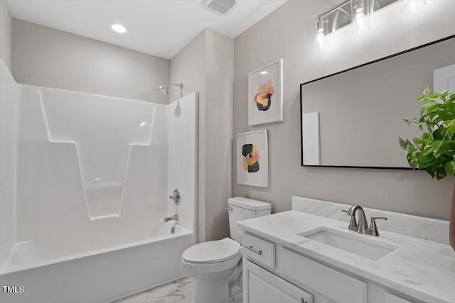 bathroom with visible vents, toilet, marble finish floor, bathtub / shower combination, and vanity