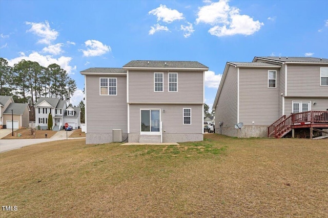 rear view of house featuring a residential view, cooling unit, a wooden deck, and a yard