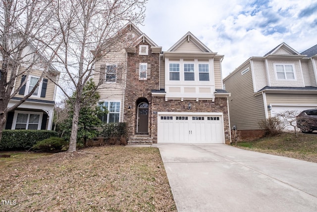 view of front of house with a garage, driveway, and stone siding