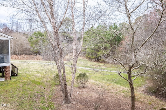 view of yard featuring a sunroom