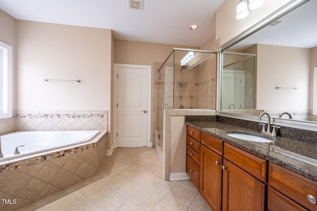 bathroom featuring a stall shower, visible vents, tile patterned flooring, vanity, and a bath