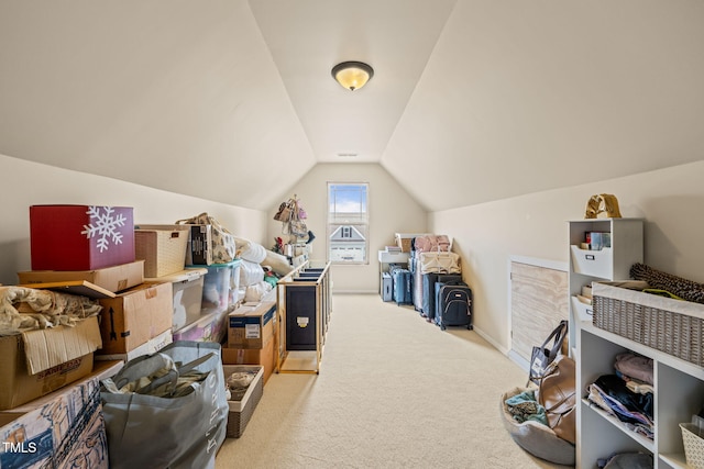 bonus room with carpet floors and lofted ceiling