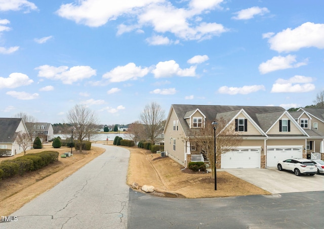 view of road with a residential view and street lighting