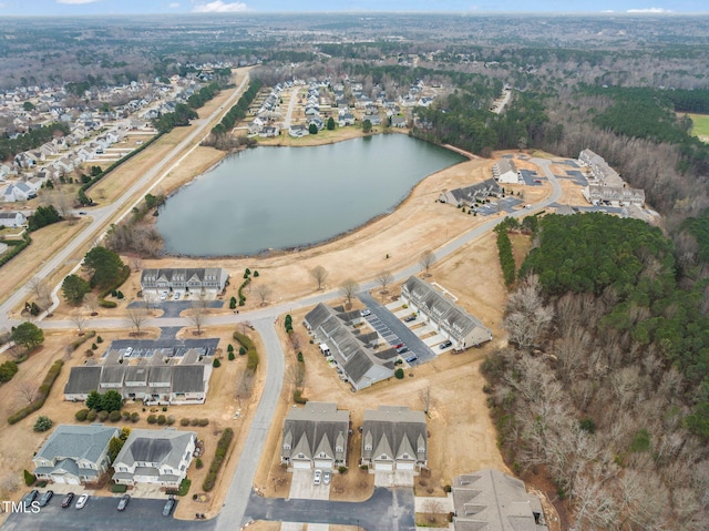 aerial overview of property's location featuring a nearby body of water and nearby suburban area