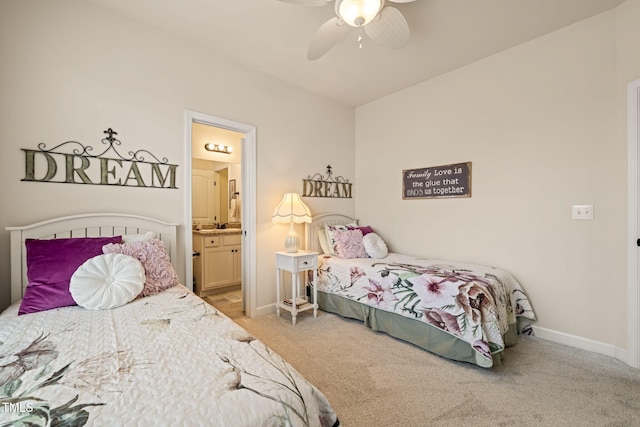 bedroom with light colored carpet, ensuite bath, baseboards, and ceiling fan