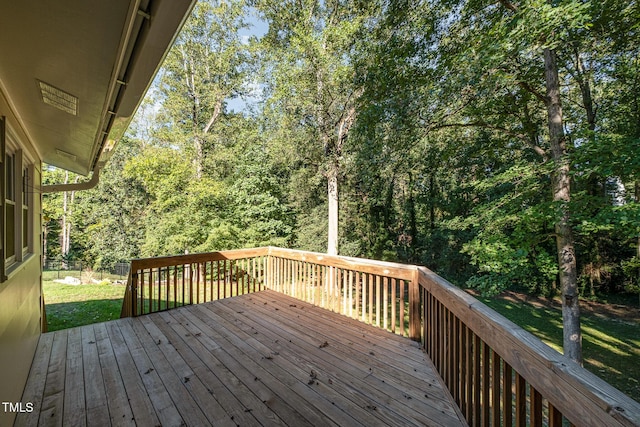 wooden deck with a yard