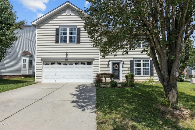 traditional-style home with driveway, a garage, and a front yard