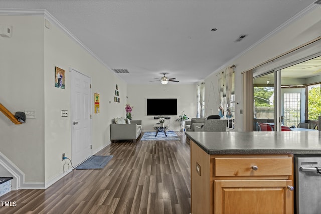 kitchen with dark wood-type flooring, visible vents, and crown molding