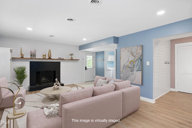 2120 Hillock Dr, Raleigh, NC 27612 - living room featuring light wood-style floors, recessed lighting, and a fireplace