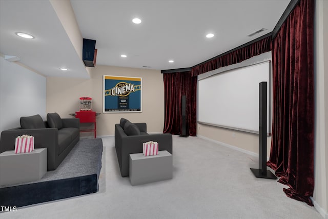 cinema room with recessed lighting, light colored carpet, visible vents, and baseboards