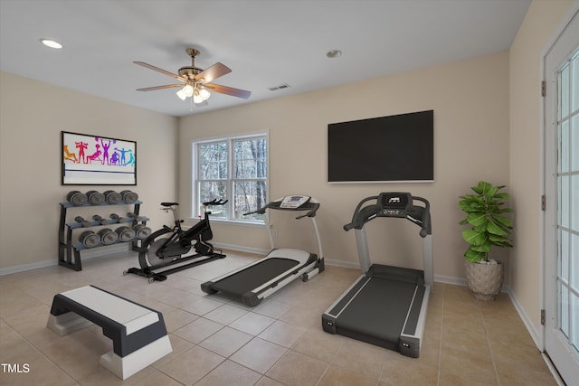 workout room featuring tile patterned flooring, baseboards, visible vents, and ceiling fan