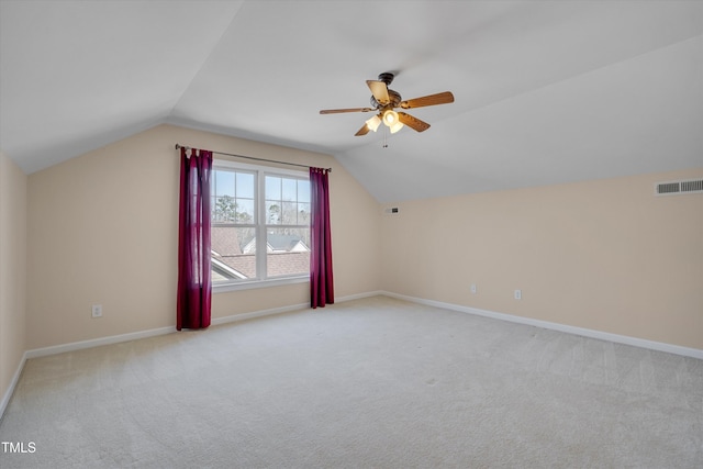 bonus room with vaulted ceiling, carpet flooring, visible vents, and baseboards