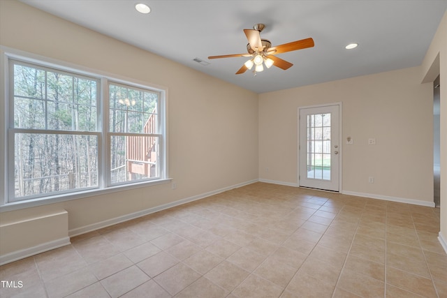 spare room with recessed lighting, light tile patterned flooring, a ceiling fan, and baseboards