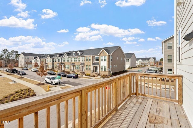 wooden deck with a residential view