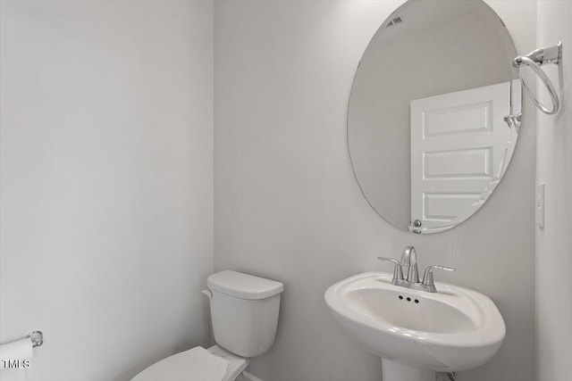 bathroom featuring a sink and toilet