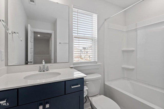 full bath featuring toilet, washtub / shower combination, vanity, and visible vents