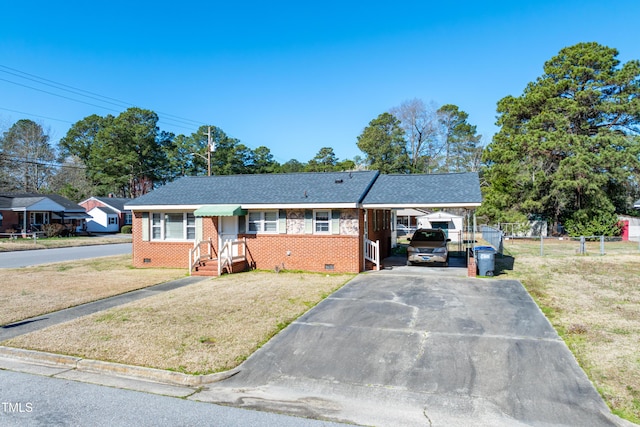 single story home with a front lawn, brick siding, driveway, and crawl space