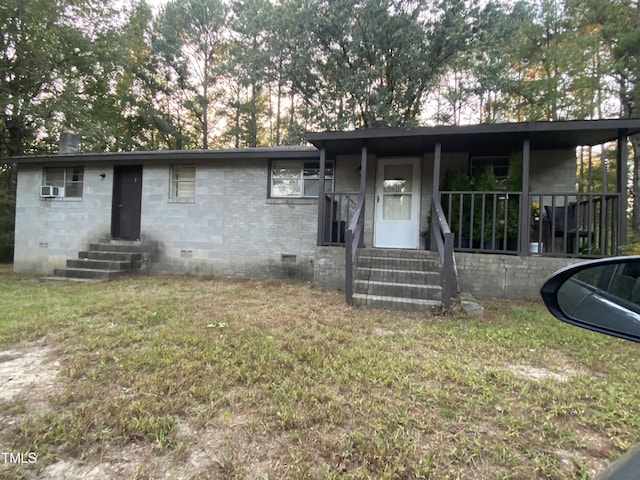 single story home featuring crawl space, covered porch, a front lawn, and entry steps