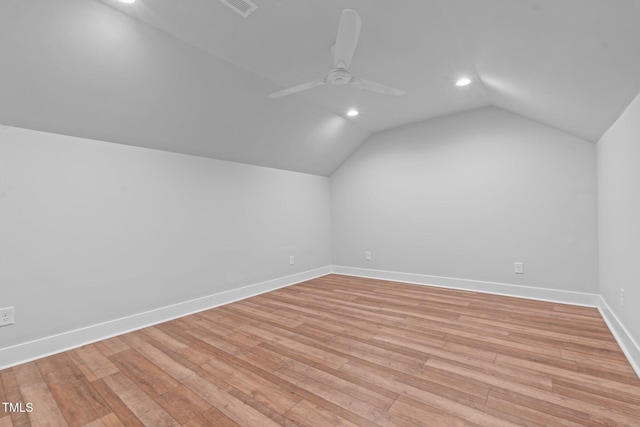 bonus room featuring ceiling fan, recessed lighting, baseboards, vaulted ceiling, and light wood finished floors