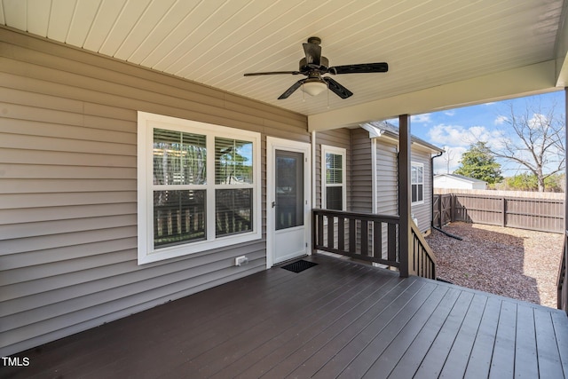 wooden deck featuring fence and a ceiling fan